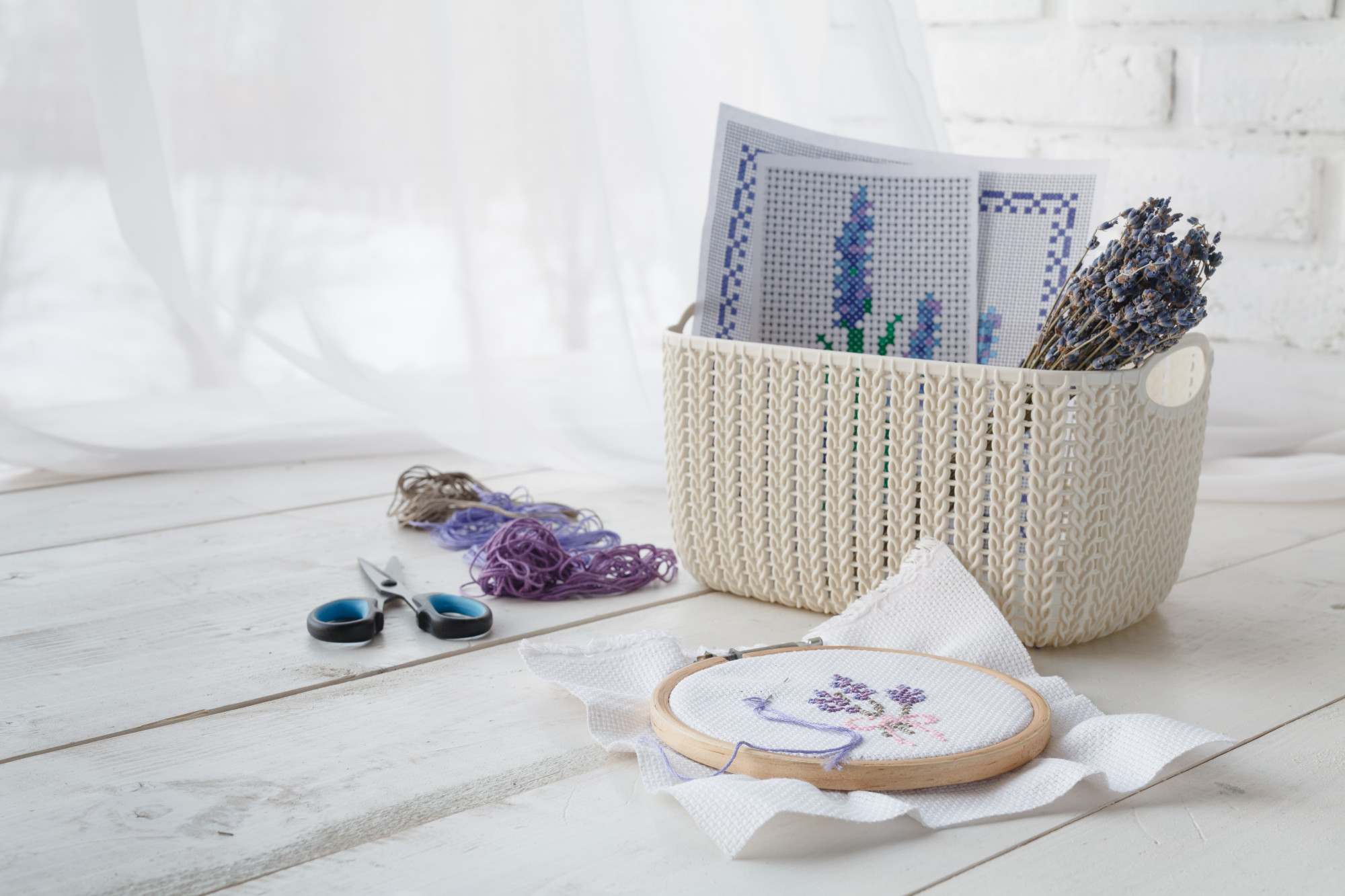 Display of embroidered samples near window